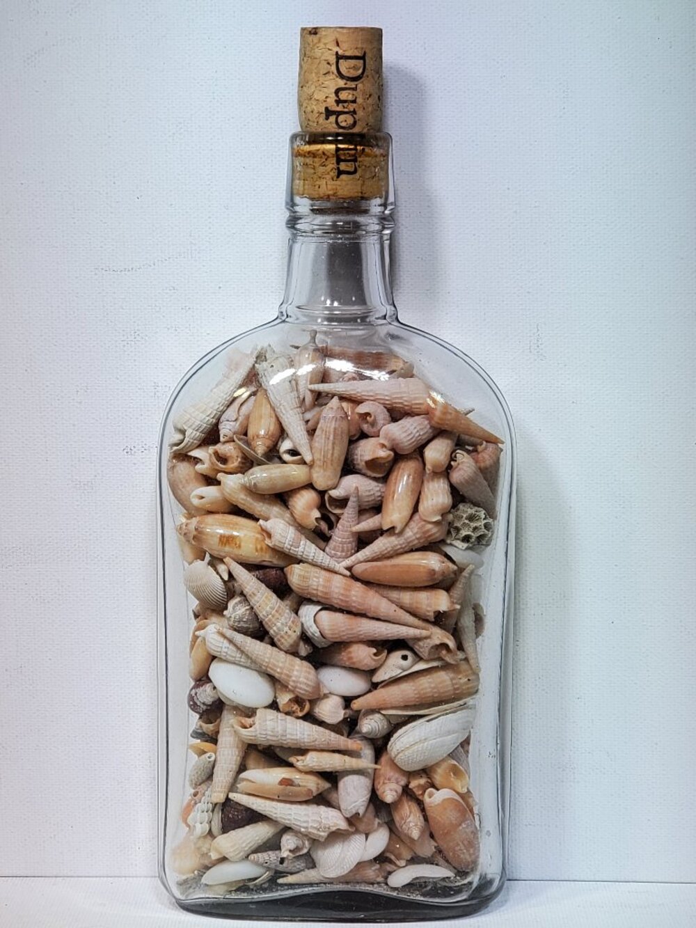 VINTAGE PINT CORK TOP BOTTLE WITH BEACH SHELLS FROM OCEAN DRIVE BEACH SC, 1990